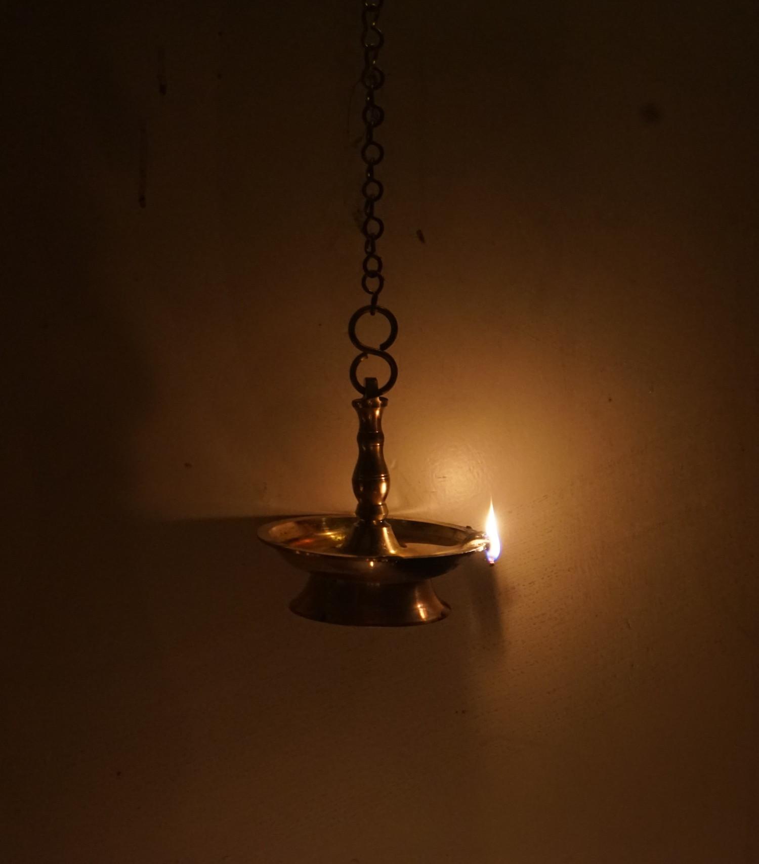 Traditional oil lamp on chain